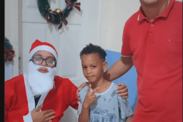 Papai Noel, criança e Gimmy. Foto: Reprodução ASCOM